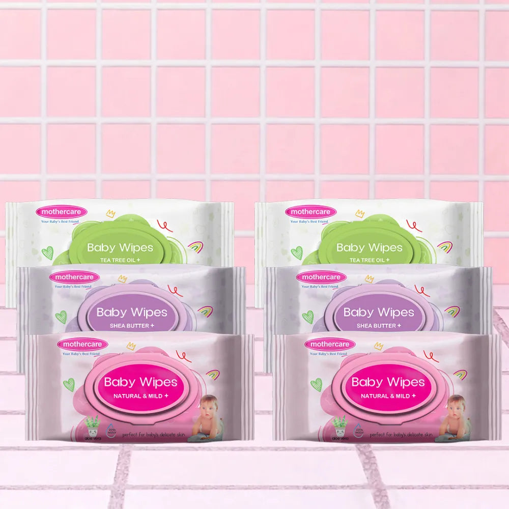 Mothercare Wipes Value Pack Includes Mothercare Baby Wipes, Two Tea Tree Oil Wipes, Two Shea Butter Wipes, And Two Natural And Mild Wipes, All Center Placed on a Tile like Background in Pink Color