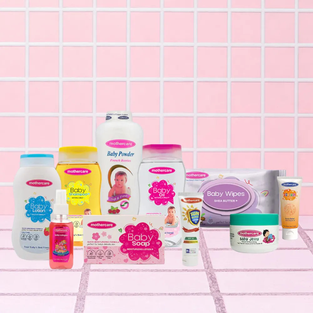 Mothercare All In One Care Box Includes Mothercare Baby Care Range, Baby Lotion, Baby Shampoo, Baby Powder, Baby Oil, Baby Wipes, Baby Jelly, Baby Rash Cream, Baby Jelly, Baby Perfume, Baby Soap, And Sunblock, All Center Placed on a Tile like Background in Pink Color