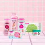 Mothercare Essential Care Kit Includes Mothercare Baby Care Range Baby Lotion, Baby Powder, Baby Oil, Baby Wipes, Baby Soap, And Baby Jelly, All Center Placed on a Tile like Background in Pink Color